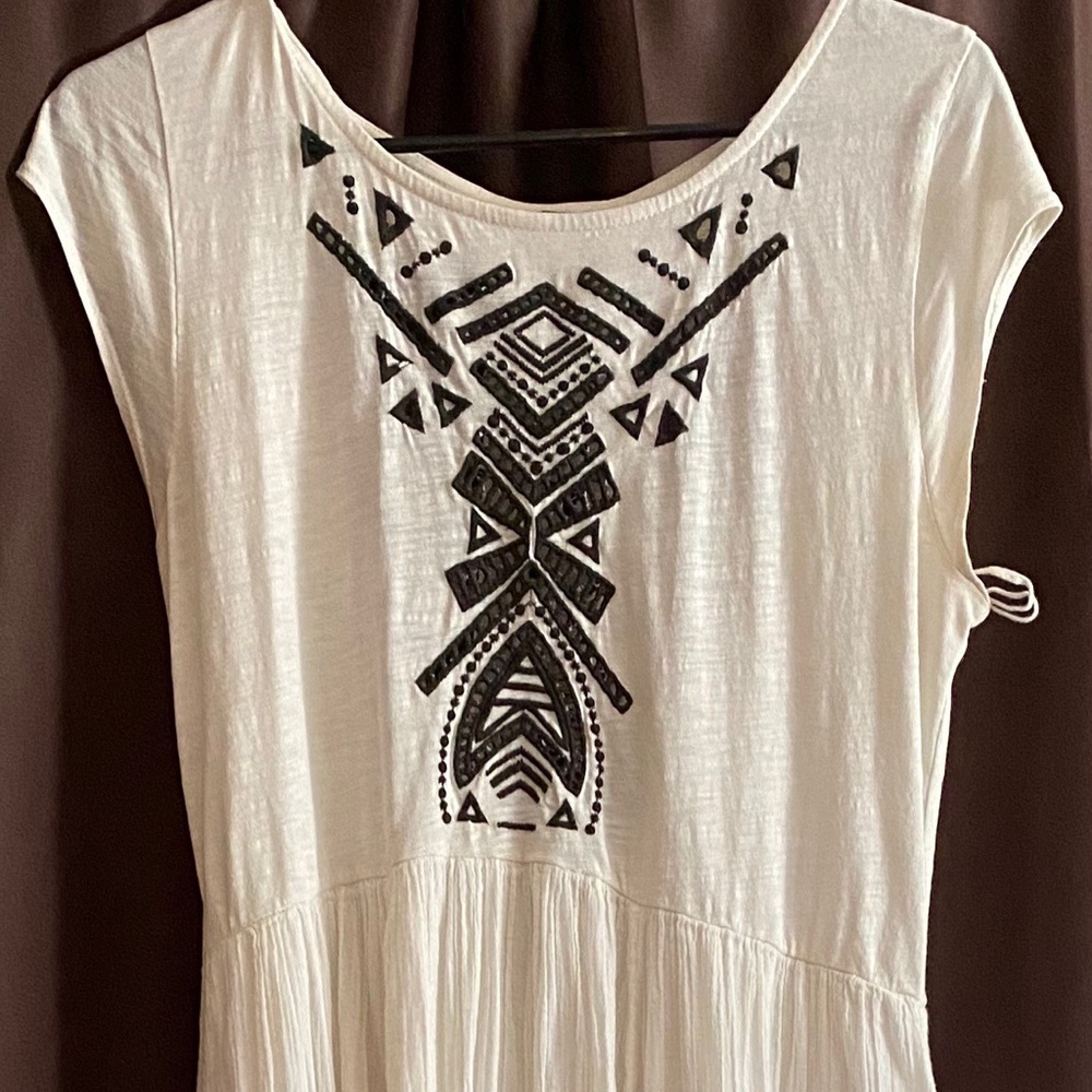 FP black embroidered white dress.